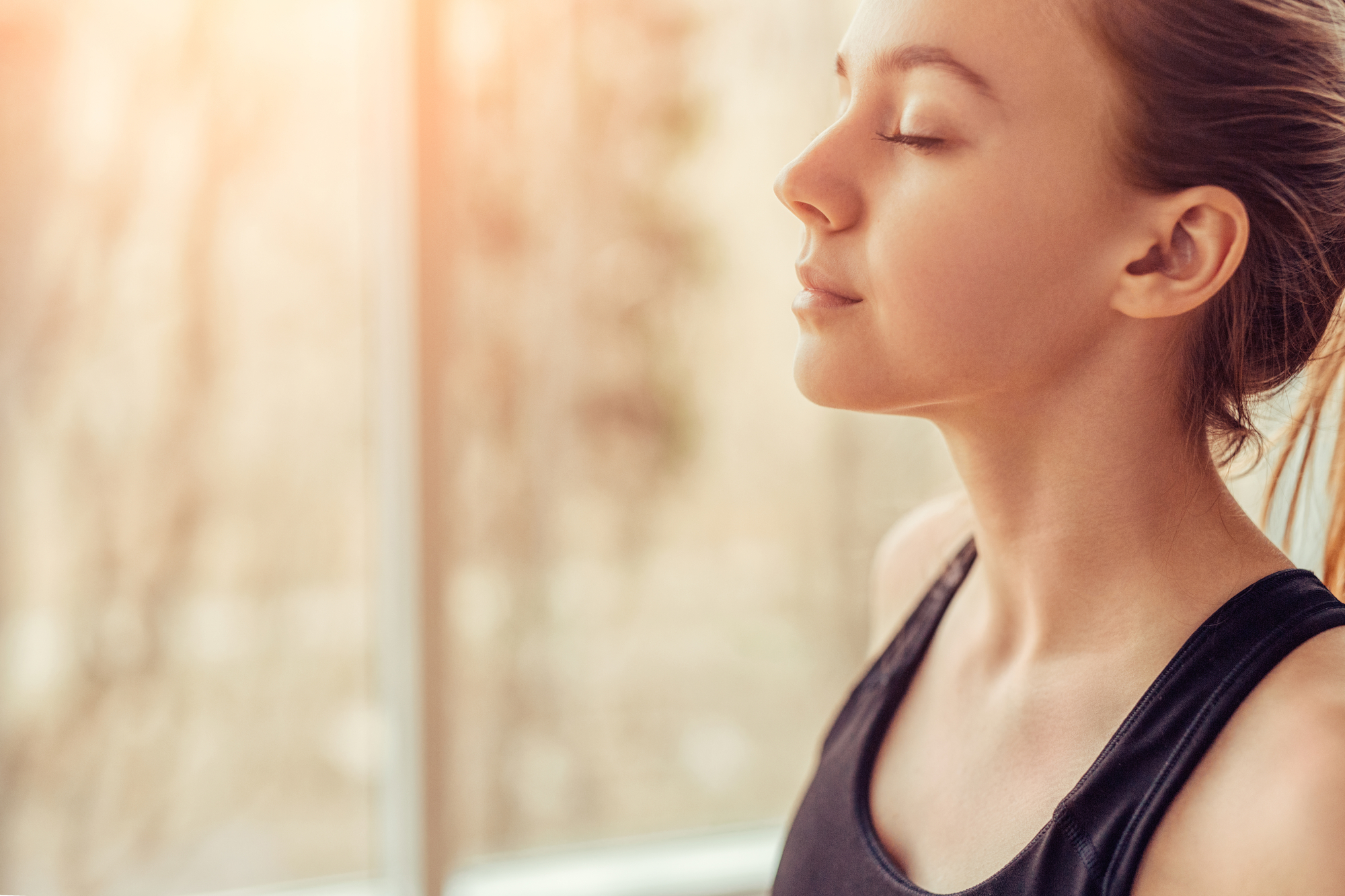 Woman practicing breathing for trauma trigger